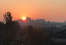 Seen from Castle View the sun rises of Windsor Castle