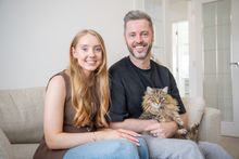 SGB-47088 – Lucy and Rob Eames and their cat Bailey in their new home in Victoria Heights