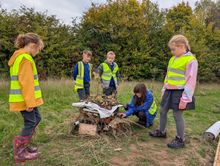 Rushwick Primary School pupils building a bug hotel at Lioncourt Homes' development The Green
