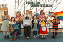 Meg Lowe Marketing Manager at Allison Homes East Midlands, gifting books to children at Cotgrave Candleby Lane School