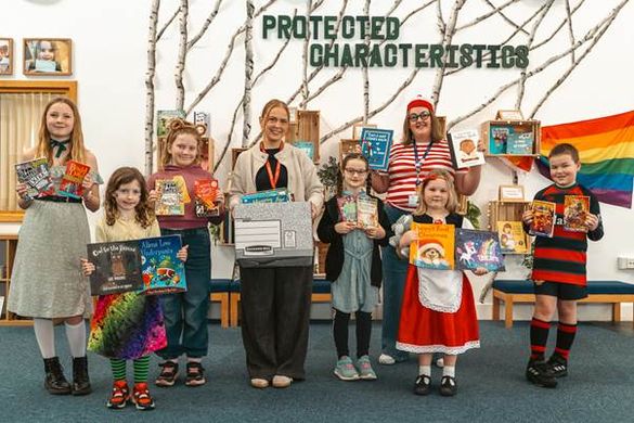 Meg Lowe Marketing Manager at Allison Homes East Midlands, gifting books to children at Cotgrave Candleby Lane School