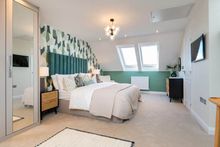 A bedroom inside the Kennett show home at Great Denham Park