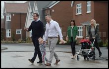 The Camerons walk with Rob, Kelly and their two children to view their home being built.
