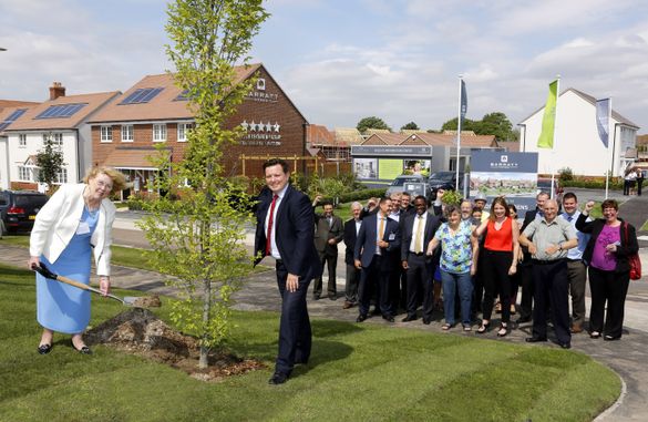 Cllr Lynda Needham and Mark Bryan, Technical Director, plant a tree at the opening of Madden Gardens Cllr Lynda Needham and Mark Bryan, Technical Director, plant a tree at the opening of Madden Gardens