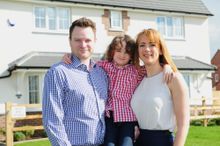 Daryl and Emma Hurley, with son Oscar outside their new home at The Wickets.